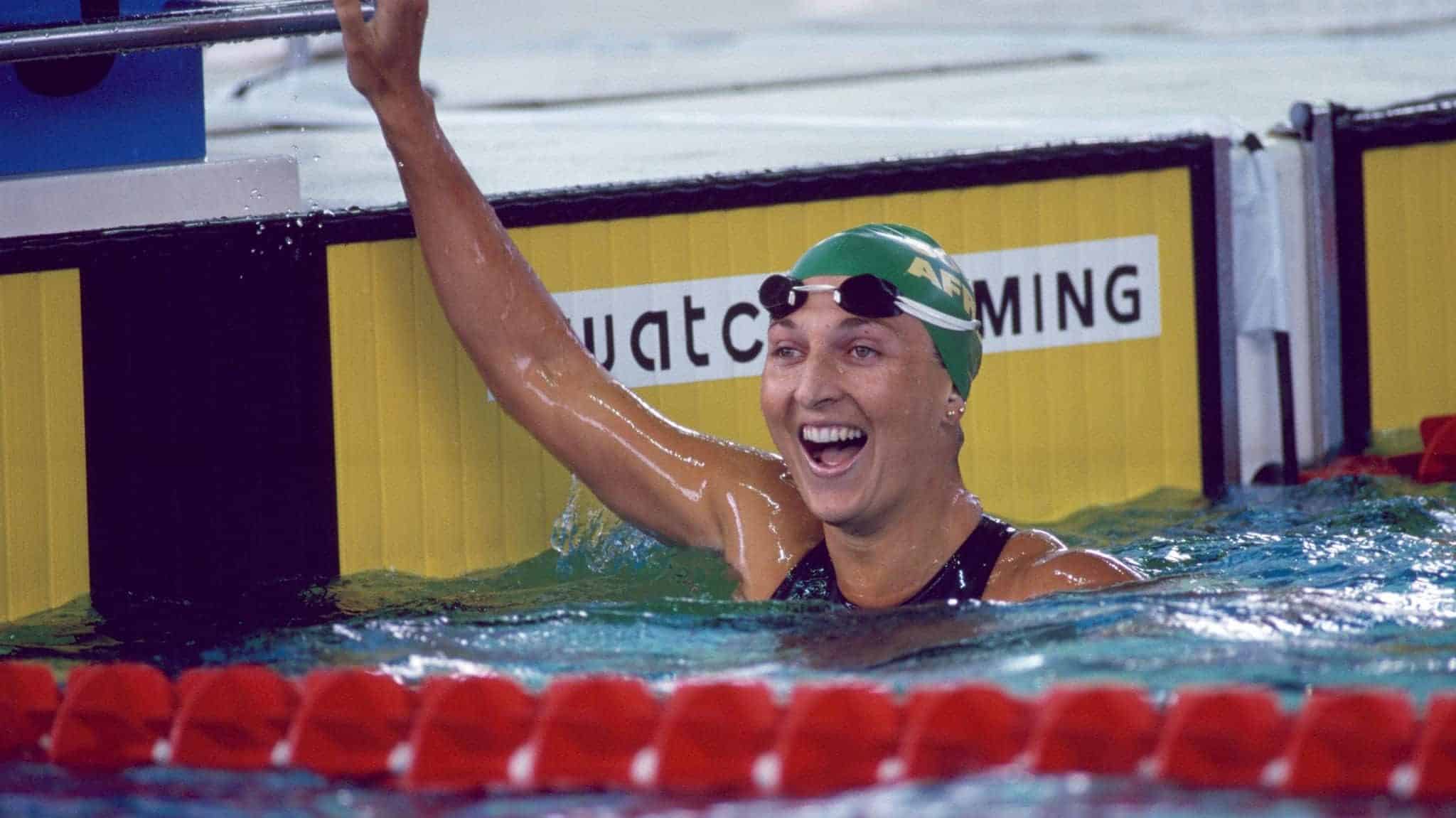 Marianne Kriel representing South Africa celebrates after winning the bronze medal in the women's 100 metre backstroke during the 1996 Summer Olympics at the Georgia Tech Aquatic Center on July 22, 1996 in Atlanta, United States. (Photo by Eileen Langsley/Popperfoto via Getty Images)